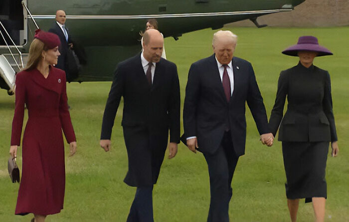 Melania Trump and others walking on grass near a helicopter showing Melania Trump's body language at Mar-a-Lago event Melania Trump and others walking on grass near a helicopter showing Melania Trump's body language at Mar-a-Lago event
