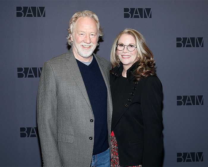 Melissa Gilbert with her husband Timothy Busfield posing together at a BAM event, both smiling for the camera.