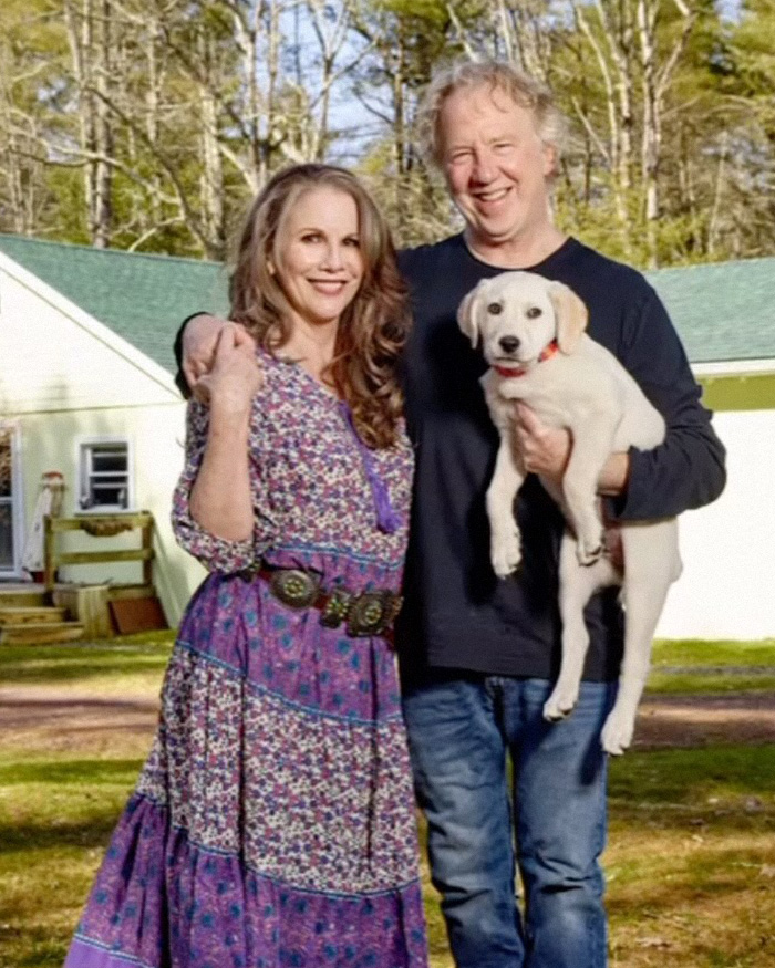 Melissa Gilbert and Timothy Busfield smiling outdoors with a dog, sparking mass fury over lengthy letter to judge.