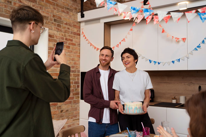 Sibling taking mom out for birthday dinner while brothers skip pitching in for the gift, celebrating with cake and smiles. Sibling taking mom out for birthday dinner while brothers skip pitching in for the gift, celebrating with cake and smiles.