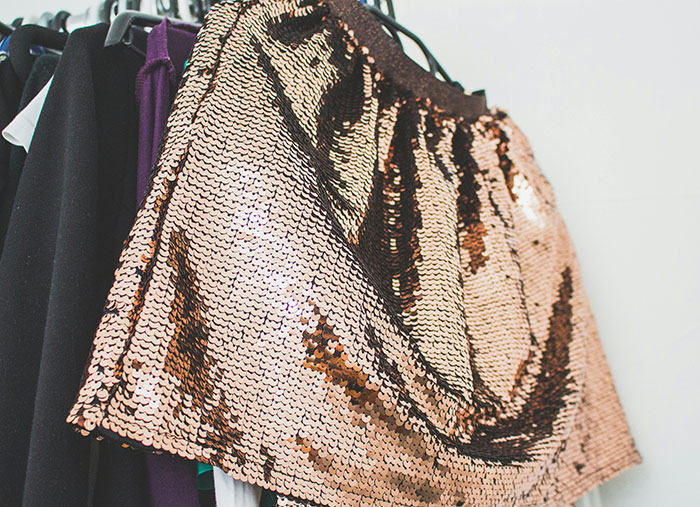 Sequin skirt hanging on a rack, highlighting the skirt that a woman steals from her 5-year-old niece.
