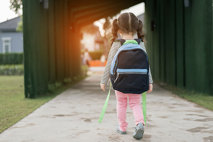 Young girl with backpack walking outside, representing a 5-year-old niece related to skirt stealing incident. Young girl with backpack walking outside, representing a 5-year-old niece related to skirt stealing incident.