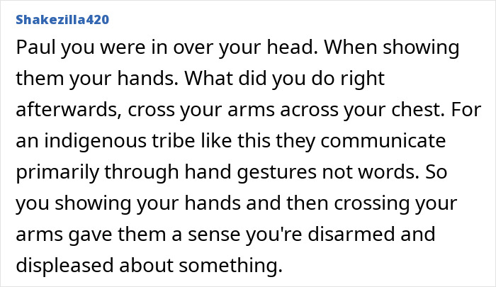Comment explaining the significance of hand gestures in communication with an uncontacted Amazonian tribe shown in footage.