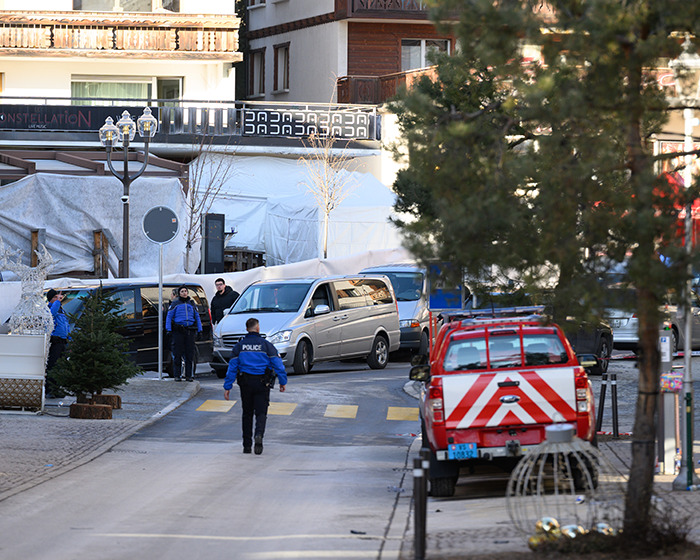 Police and emergency vehicles at the scene of the horrific Swiss resort blaze claiming nearly 50 lives