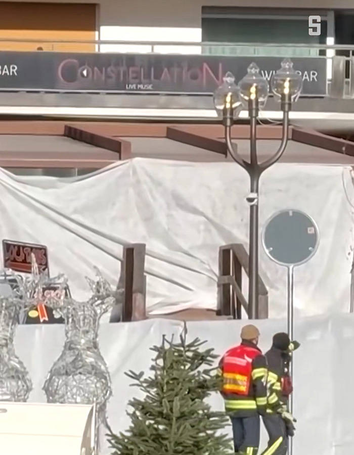 Firefighters inspect the Swiss ski bar site covered after lethal fire, highlighting possible negligence cause in the accident. Firefighters inspect the Swiss ski bar site covered after lethal fire, highlighting possible negligence cause in the accident.