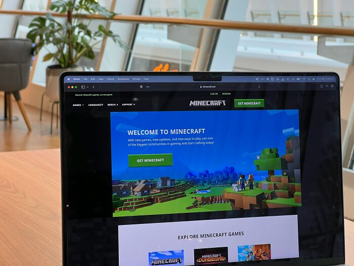 Laptop displaying Minecraft game page in a modern workspace, illustrating moments so ridiculous people thought they were pranked.