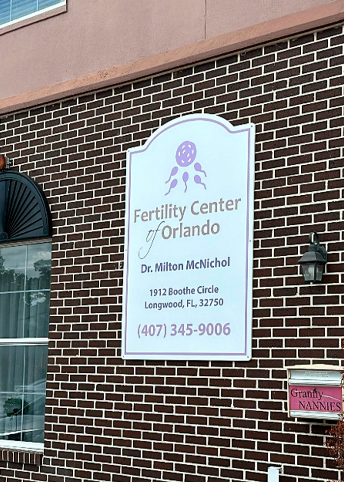 Sign for Fertility Center of Orlando on brick wall, related to parents suing fertility clinic after shocking mix-up. Sign for Fertility Center of Orlando on brick wall, related to parents suing fertility clinic after shocking mix-up.