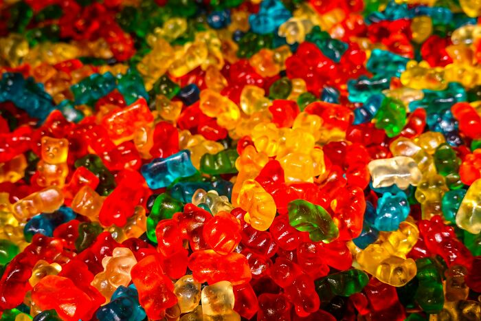 Colorful gummy bears piled close-up, illustrative image for Woman Furious story Colorful gummy bears piled close-up, illustrative image for Woman Furious story