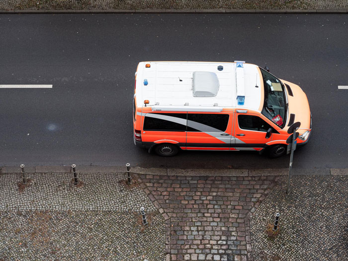 Ambulance driving on city street, illustrating partner sleep emergency and calling ambulance for help. Ambulance driving on city street, illustrating partner sleep emergency and calling ambulance for help.