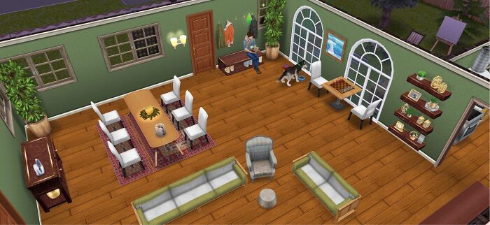 Top-down view of a cozy living room with furniture and a person on a bench, illustrating real-life cheat codes concept.