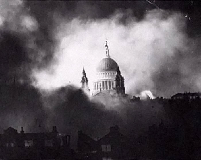 Black and white photo of a historic building shrouded in smoke, evoking powerful emotions in country photo memories.