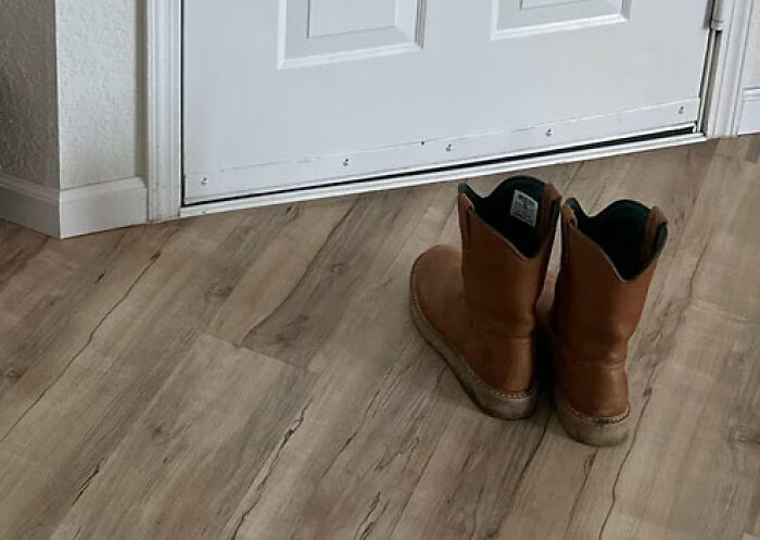 Pair of brown boots left by the front door symbolizing people share wildest ways found out cheating stories.