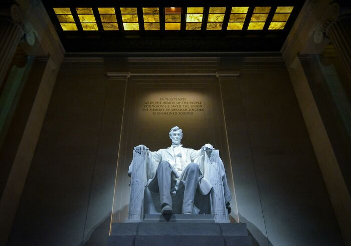 Statue of Abraham Lincoln at the Lincoln Memorial, symbolizing U.S. presidents from Washington to Trump in historical order.