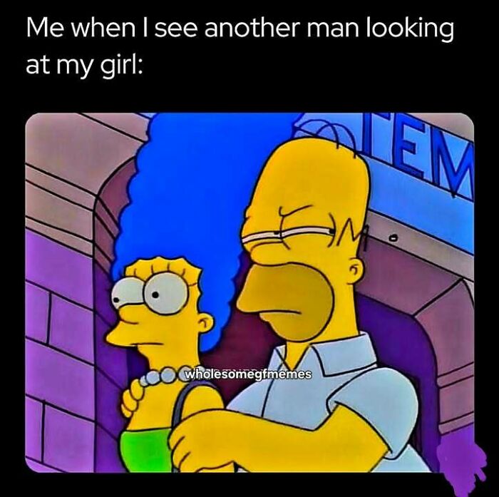 Homer protectively holding Marge with a jealous expression, a loving meme to send to your girlfriend.