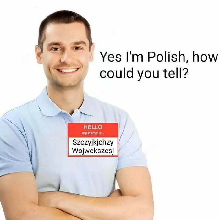 Smiling man with a name tag showing a complex Polish name, highlighting the Eastern European experience humor in meme format.