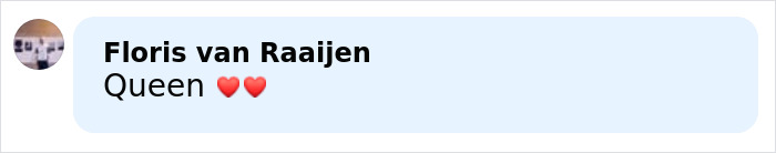 Comment saying Queen with two red heart emojis on a light blue speech bubble background.