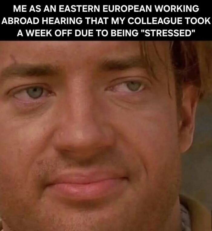 Close-up of a man’s face expressing disbelief about a stressed colleague, capturing the Eastern European experience meme.