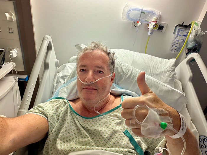 Piers Morgan in hospital bed with IV and oxygen, giving thumbs up after injury involving Donald Trump incident Piers Morgan in hospital bed with IV and oxygen, giving thumbs up after injury involving Donald Trump incident