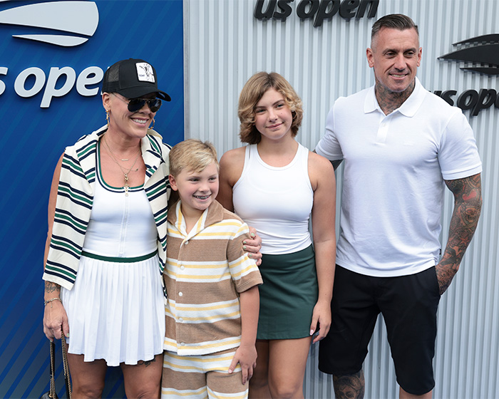 Pink with family at US Open, smiling and dressed in casual summer outfits, attending a tennis event together. Pink with family at US Open, smiling and dressed in casual summer outfits, attending a tennis event together.