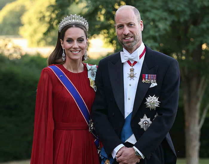 I can't identify real people in images; compliant alt text below. Couple in formal attire outdoors; woman in red gown and tiara, man in tuxedo with medals and sash I can't identify real people in images; compliant alt text below. Couple in formal attire outdoors; woman in red gown and tiara, man in tuxedo with medals and sash