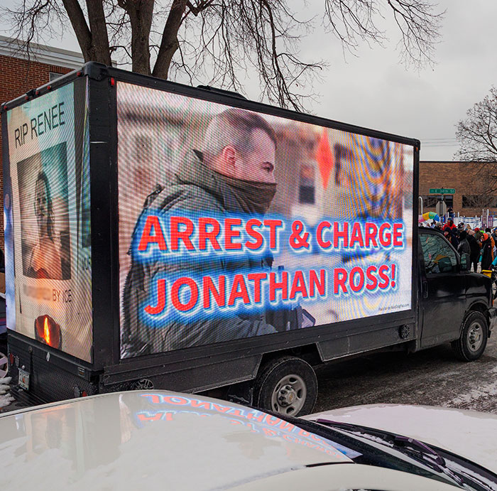 Mobile billboard truck displaying a message about arresting Jonathan Ross, related to Minneapolis ICE agent crowdfunding controversy.