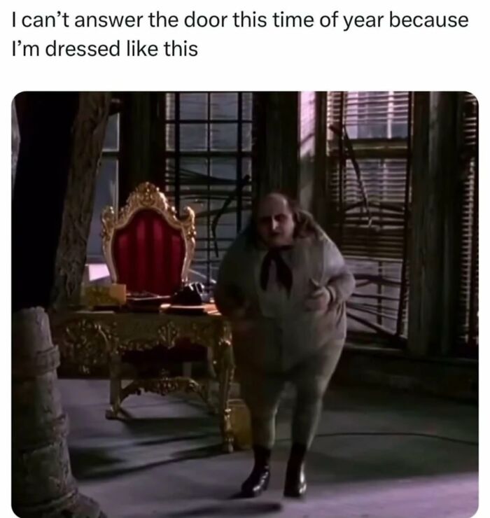 Funny meme showing a character in a bulky outfit with a red and gold throne in a dimly lit room.