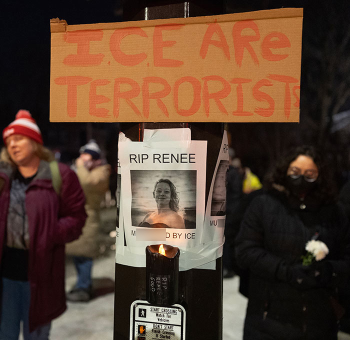 Protesters gather near vigil with signs condemning ICE after mom of a 6-year-old k****d in Minneapolis car incident. Protesters gather near vigil with signs condemning ICE after mom of a 6-year-old k****d in Minneapolis car incident.