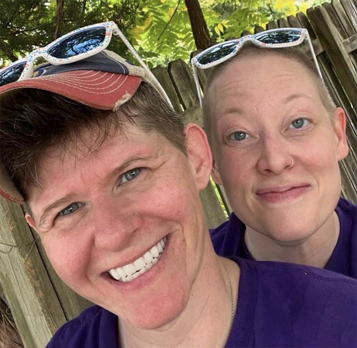 Couple outdoors wearing sunglasses, representing Renee Good’s wife breaking silence on fatal ICE incident in community. Couple outdoors wearing sunglasses, representing Renee Good’s wife breaking silence on fatal ICE incident in community.