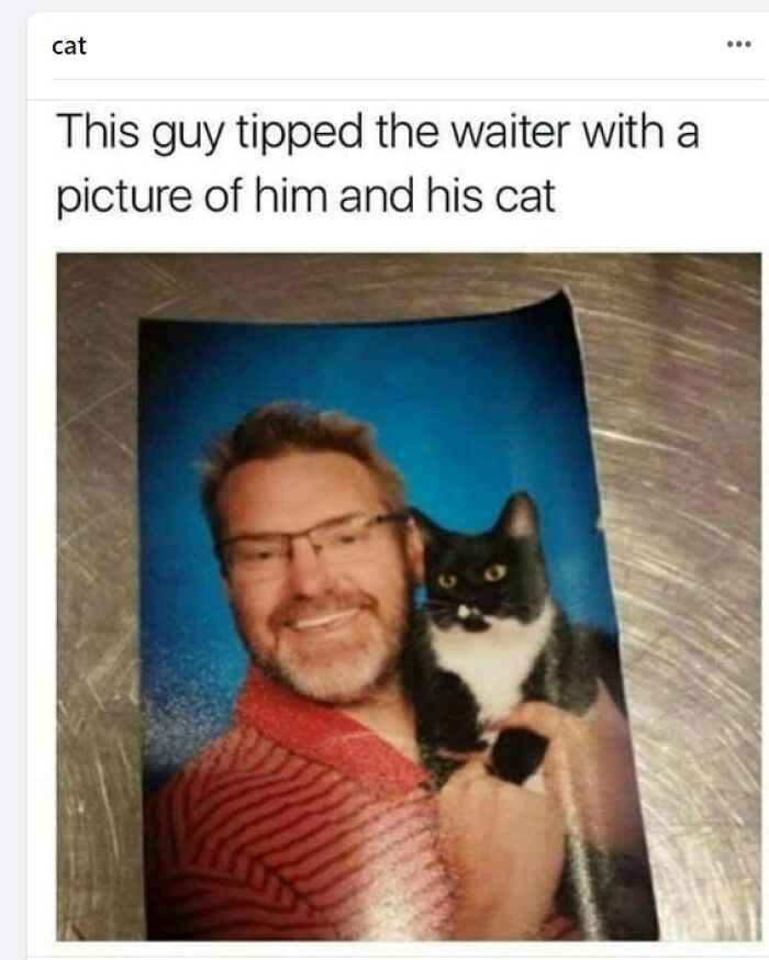 Man tipping waiter with a photo of himself and his cat, a humorous moment related to restaurant workers and memes.