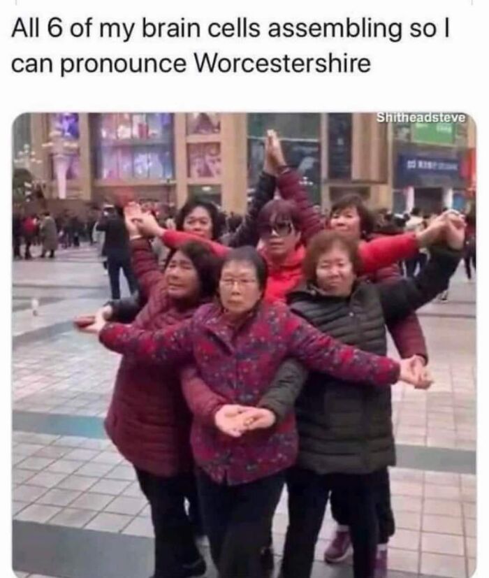 Group of people humorously posing to represent restaurant workers' brain cells assembling to pronounce Worcestershire sauce.
