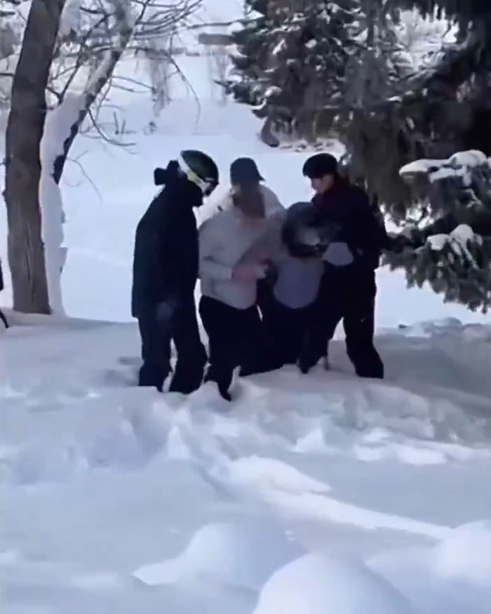 Skiers helping injured person in snowy forest after snow leopard attack caught on viral video. Skiers helping injured person in snowy forest after snow leopard attack caught on viral video.