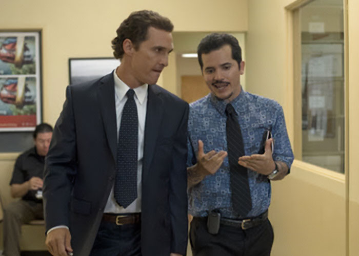 Star actor in a suit talking to a casually dressed man in an office hallway amid controversy over ICE and fan backlash Star actor in a suit talking to a casually dressed man in an office hallway amid controversy over ICE and fan backlash