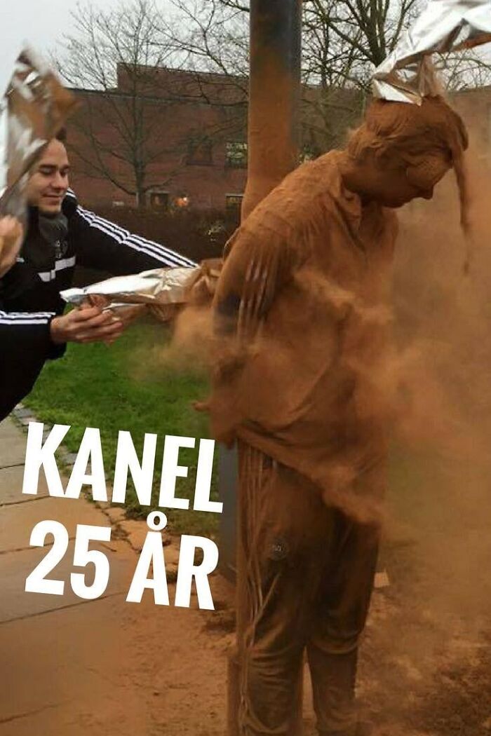 Person covered in cinnamon powder during a strange tradition celebrating a 25th birthday outdoors in chilly weather.