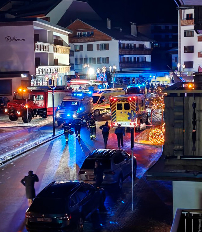 Emergency responders and vehicles at night at a ski resort after an explosion causing numerous casualties. Emergency responders and vehicles at night at a ski resort after an explosion causing numerous casualties.