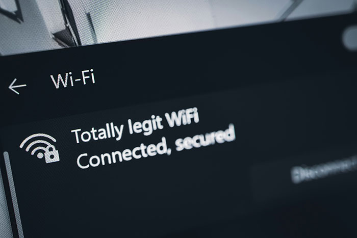 WiFi hotspot named Totally legit WiFi connected and secured on a device screen related to fighter jets escort incident.