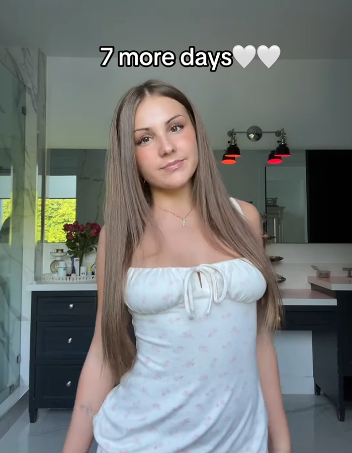 Teen influencer posing indoors with long hair and white dress, promoting app debut that nets $1M in first hour. Teen influencer posing indoors with long hair and white dress, promoting app debut that nets $1M in first hour.
