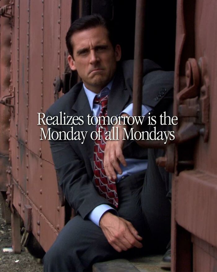 Man in a suit sitting on a train step with a serious expression, meme inspired by The Office TV series.