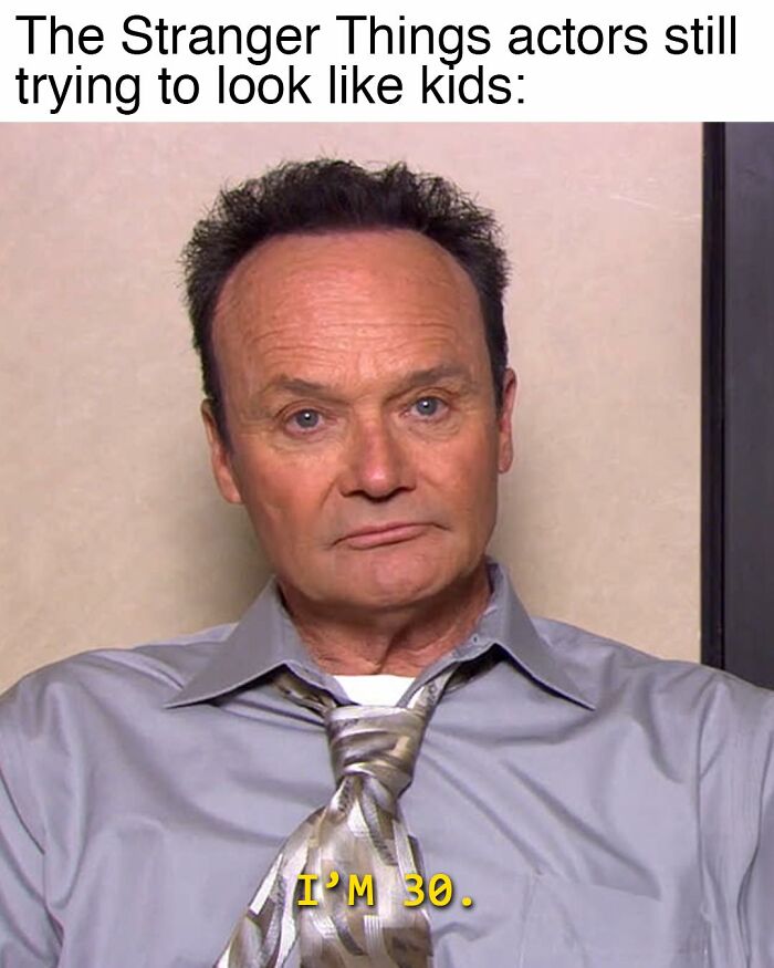 Meme from The Office featuring a man in shirt and tie with text about Stranger Things actors trying to look like kids.