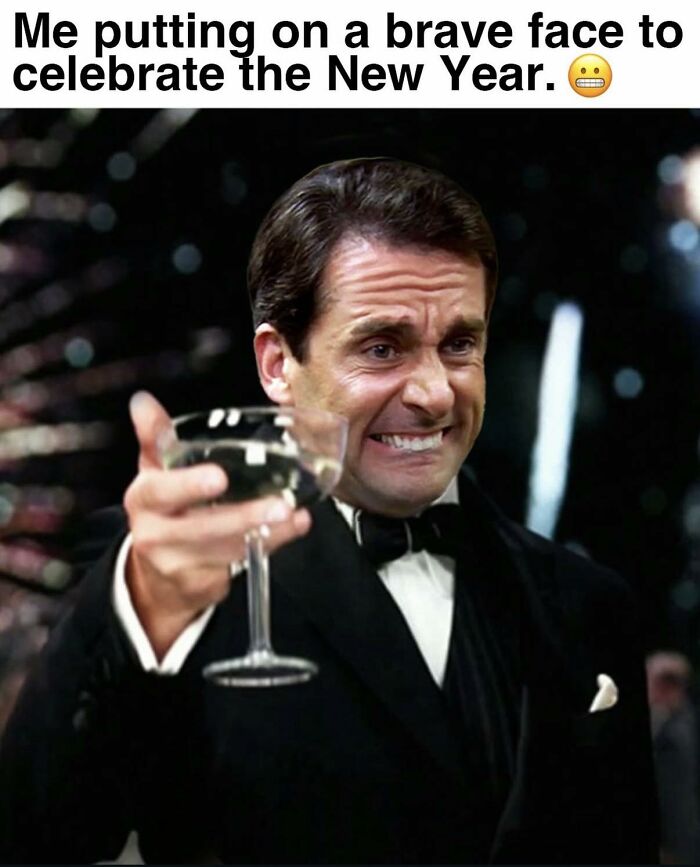 Man from The Office with a forced smile raising a glass in a tuxedo, meme inspired by the TV series The Office.