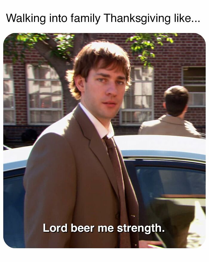 Man in a suit near a car with caption about needing strength, a popular meme inspired by the TV series The Office.