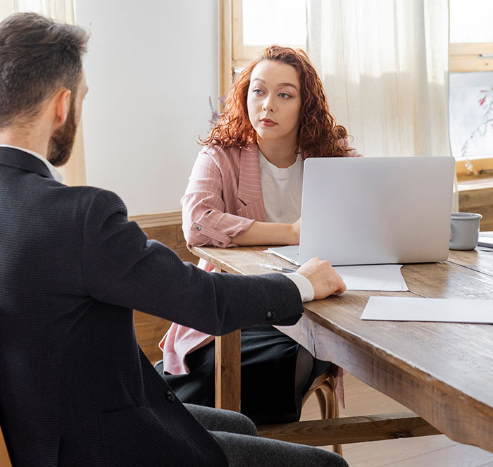 Candidate sitting across recruiter during interview, illustrating how job candidates instantly lost any chance of getting the job.