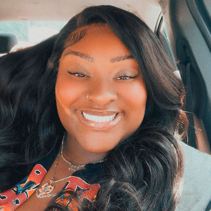 TikTok influencer smiling in car selfie after owing 1.75M for admitting inappropriate act in couple&rsquo;s home.