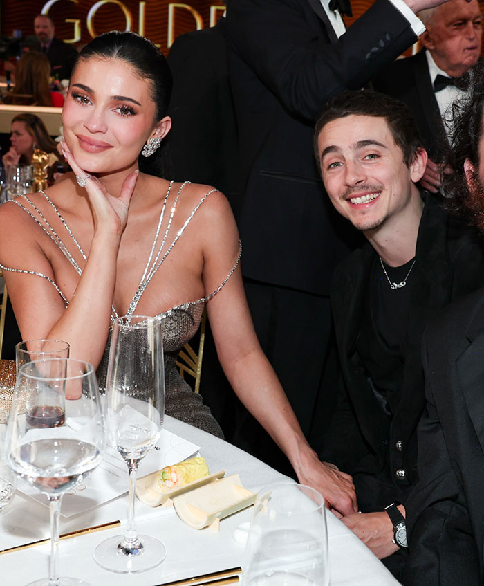 Kylie Jenner and Timothée Chalamet seated at a formal event, highlighting their Golden Globes connection and recent fight exposure. Kylie Jenner and Timothée Chalamet seated at a formal event, highlighting their Golden Globes connection and recent fight exposure.