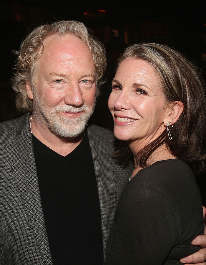 Actor Timothy Busfield with a woman at an event, related to US Marshals manhunt and accusations of horrific crimes.