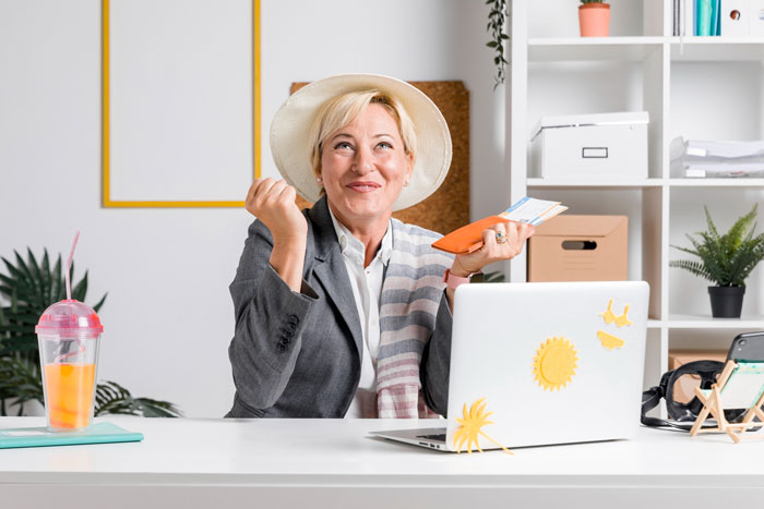 Woman at desk expressing relief and confidence, symbolizing a DIL putting her foot down against overbearing MIL plans. Woman at desk expressing relief and confidence, symbolizing a DIL putting her foot down against overbearing MIL plans.