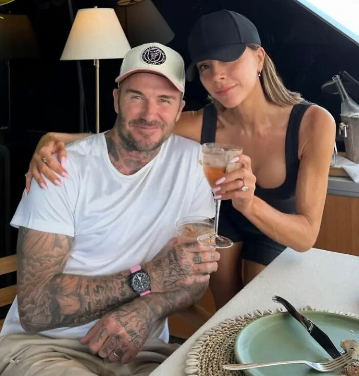 David and Victoria Beckham sitting together with drinks, amidst Brooklyn Beckham family feud and legal dispute headlines. David and Victoria Beckham sitting together with drinks, amidst Brooklyn Beckham family feud and legal dispute headlines.