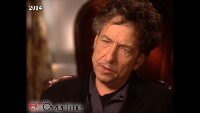 Man with curly hair in a 2004 interview, reflecting deeply, related to people meeting their idols and regretting it.