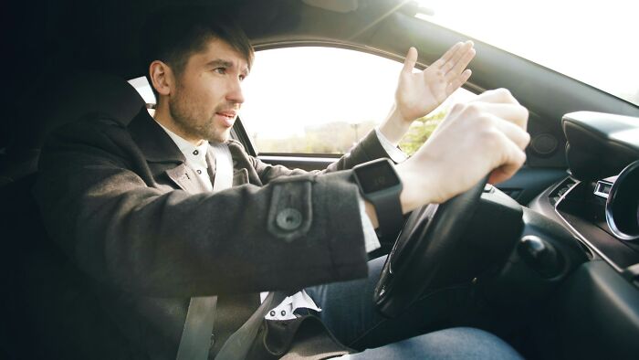 Man driving a car, showing daily dangers and risks people might not realize they face regularly behind the wheel