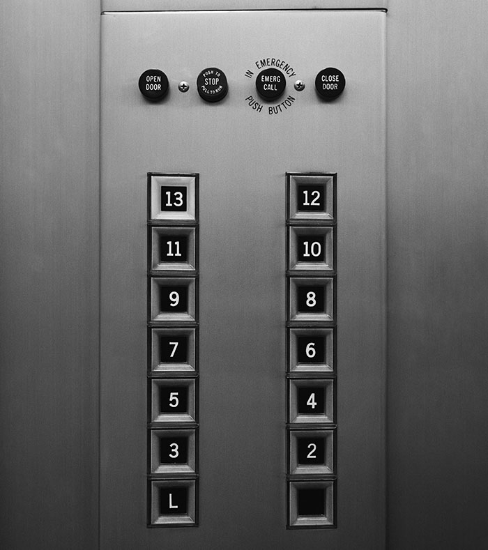 Elevator panel showing unusual floor numbers with no button for floor 1, a weird sight people witnessed and can't explain.