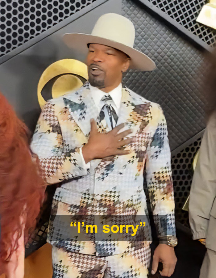 Jamie Foxx in patterned suit and hat on Grammy red carpet during a weird moment with Chappell Roan going viral. Jamie Foxx in patterned suit and hat on Grammy red carpet during a weird moment with Chappell Roan going viral.